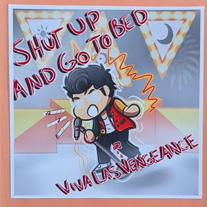 May include: A cartoon illustration features a character with sunglasses holding a microphone. The text "SHUT UP AND GO TO BED" and "VIVA LAS VENGEANCE" are displayed in red. The background includes stage lights and a sun and moon symbol.