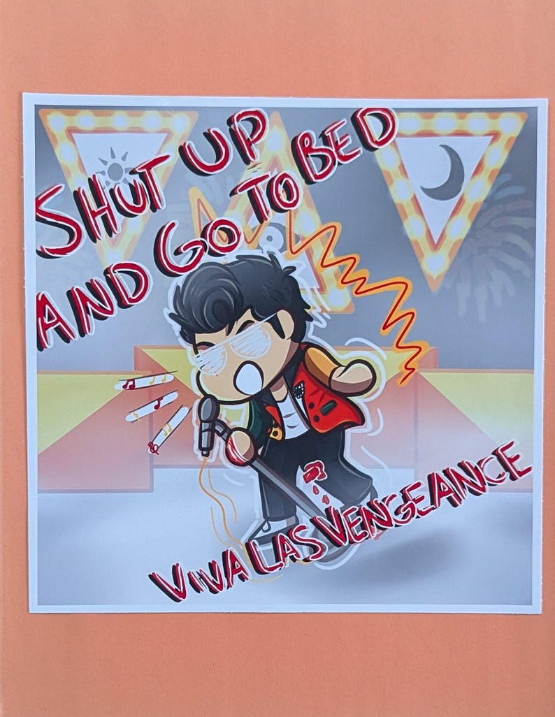 May include: A cartoon illustration features a character with sunglasses holding a microphone. The text "SHUT UP AND GO TO BED" and "VIVA LAS VENGEANCE" are displayed in red. The background includes stage lights and a sun and moon symbol.