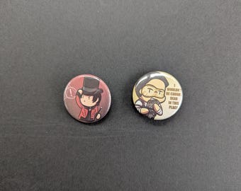 May include: Two round pinback buttons. One features a cartoon character in a red coat and top hat, holding a wand. The other button has a cartoon character with a mustache and the text "I WOULDN'T BE CAUGHT DEAD IN THIS PLACE."
