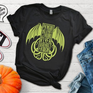 May include: Black t-shirt with a green graphic of a Cthulhu-like creature with the text "PH'NGlui Mglw'nafh Cthulhu R'lyeh Wgah'nagl Fhtagn".