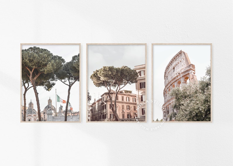 May include: Three framed prints of Rome, Italy. The first print shows a view of the city with two trees in the foreground. The second print shows a view of a street with a tree in the foreground. The third print shows a view of the Colosseum.