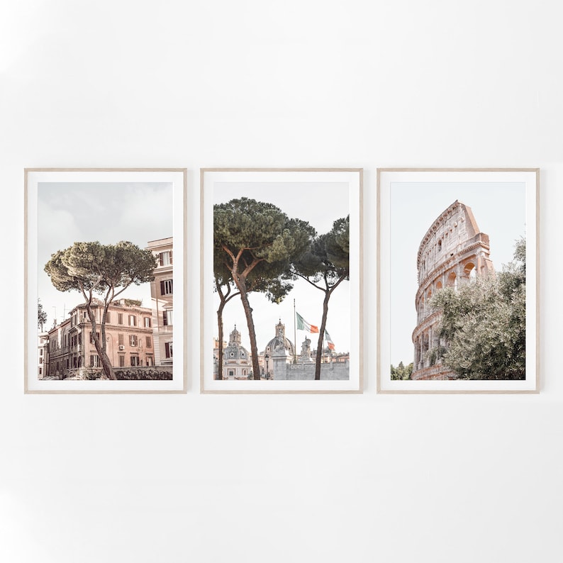 May include: Three framed prints of Rome, Italy. The first print shows a view of the city with a large tree in the foreground. The second print shows a view of the city with a large tree in the foreground and a church in the background. The third print shows a view of the Colosseum.