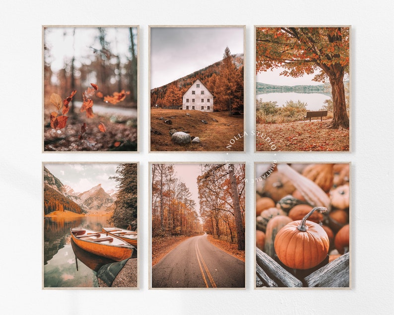May include: Set of six autumn-themed prints featuring a variety of scenes, including a cabin in the woods, a lake with fall foliage, a road lined with trees, and a close-up of pumpkins.