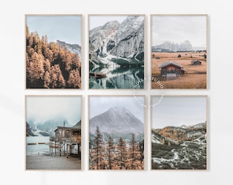 May include: Set of six landscape photography prints featuring mountain ranges, lakes, and cabins. The prints are in a rustic style with warm tones and muted colors.