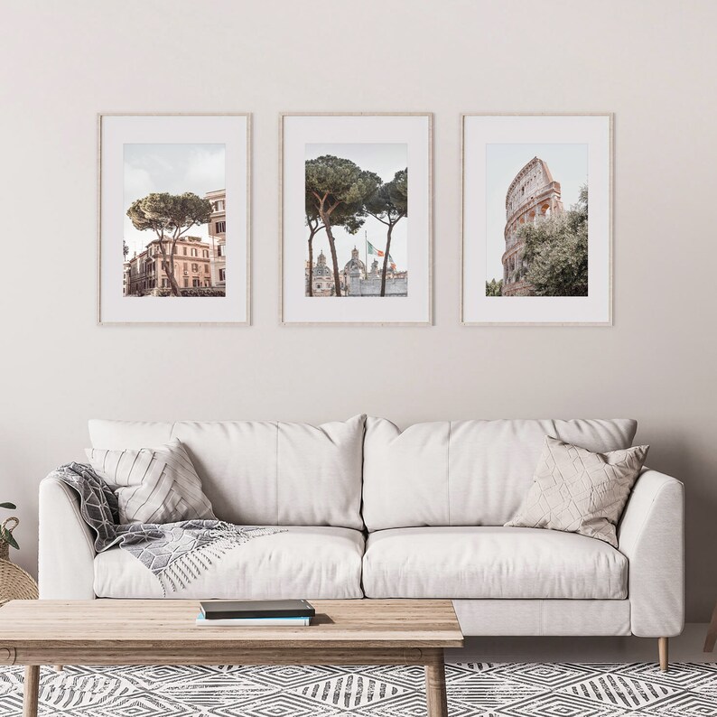 May include: Three framed prints of Rome, Italy. The first print shows a street scene with a building and a tree. The second print shows a tree in front of a building with a flag. The third print shows the Colosseum.