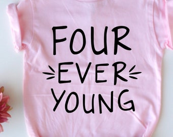 May include: A light pink t-shirt with the words "FOUR EVER YOUNG" in black. The shirt is paired with blue denim shorts. The text is centered on the shirt.