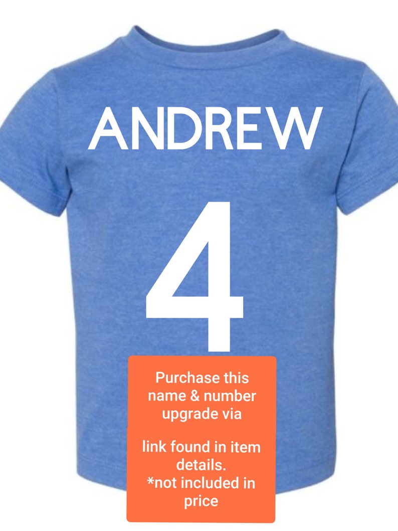 May include: A light blue t-shirt with the name "ANDREW" and the number "4" printed in white. The text "Purchase this name & number upgrade via link found in item details. *not included in price" is printed in white on a red rectangle.