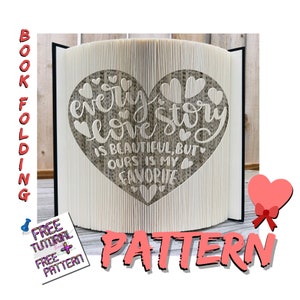 May include: A book folding pattern for a heart with the text "Every love story is beautiful, but ours is my favourite". The pattern is printed on a white background with a pink heart in the corner.