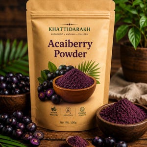 May include: A tan stand-up pouch of Khattidarakh Acaiberry Powder with a net weight of 100g. The packaging features text, a wooden bowl filled with deep purple powder, and illustrations of acai berries and green palm leaves on the front.