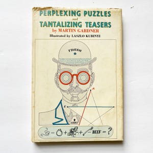May include: Vintage book cover titled "Perplexing Puzzles and Tantalizing Teasers" by Martin Gardner. The cover features a stylized illustration of a man with a hat, red glasses, and a mustache. The design includes a maze within the hat and mathematical symbols.