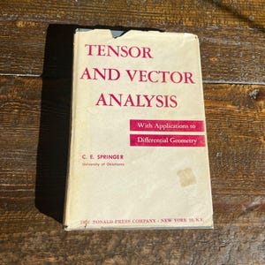 May include: A vintage book titled "Tensor and Vector Analysis" with red text on a cream-colored cover. The book includes the subtitle "With Applications to Differential Geometry" and the author's name, C. E. Springer. The book is from the University of Oklahoma.