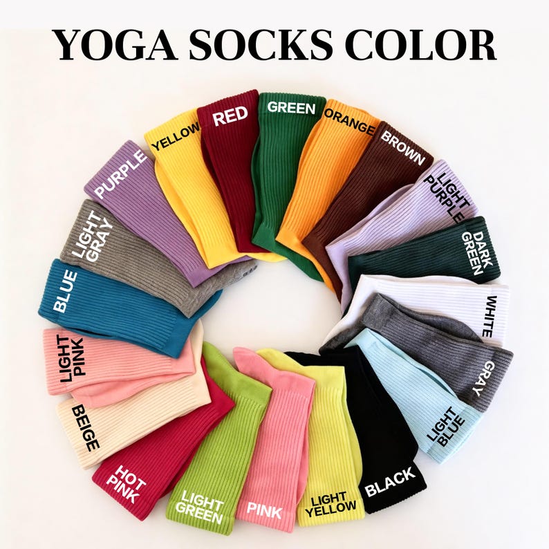 May include: A circular arrangement of ribbed yoga socks in various colors including purple, yellow, red, green, orange, brown, light purple, dark green, white, gray, light blue, black, light yellow, pink, light green, hot pink, beige, light pink, blue, and light gray.