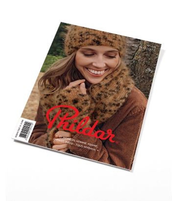 May include: A Phildar magazine cover featuring a person wearing a fuzzy, tan and black leopard-print knit beanie, scarf, and fingerless gloves. The person wears a brown corduroy jacket. The cover text includes Phildar, N&deg; 226, and 77 MOD&Egrave;LES.