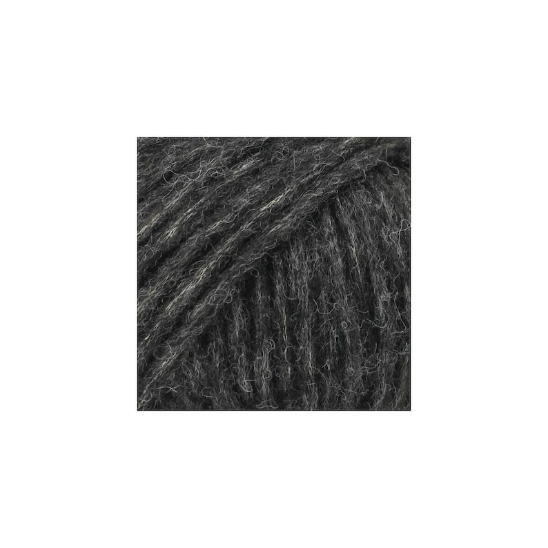 May include: A ball of dark charcoal gray yarn featuring a fuzzy, brushed texture with visible individual fibers. The yarn is wound in a tight, uniform pattern, displaying a consistent deep gray color throughout the entire surface of the ball.
