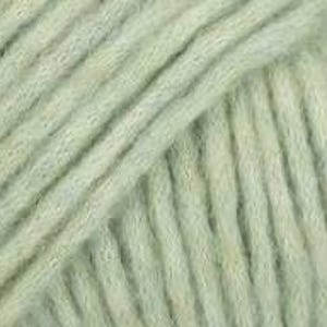 May include: A close-up view of light sage green yarn, showcasing the twisted fiber construction and soft, fuzzy texture of the strands. The yarn is arranged in parallel diagonal lines, highlighting the consistent ply and matte finish of the material.