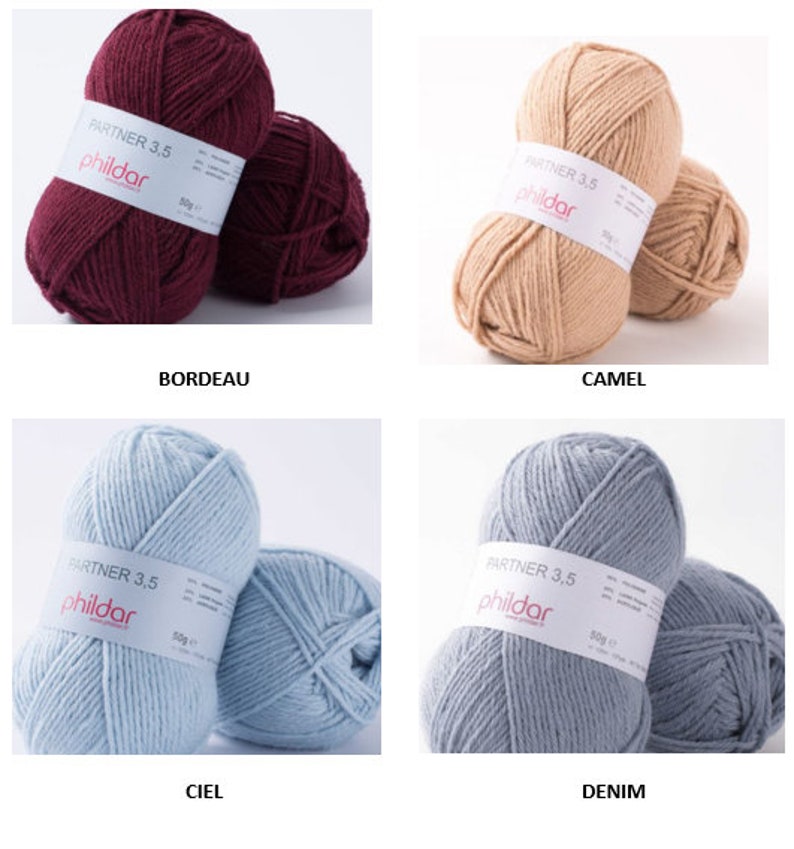 Peut inclure: Quatre pelotes de laine de couleurs diff&eacute;rentes : bordeaux, camel, bleu clair et gris. Chaque pelote porte une &eacute;tiquette blanche avec le texte "PARTNER 3,5 phildar 50g".