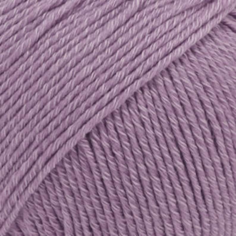 May include: A skein of soft, light purple yarn.
