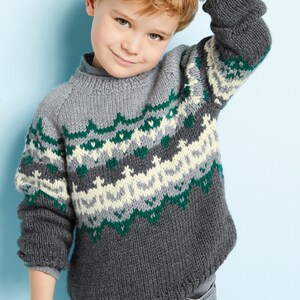 May include: A gray, green, and white knitted sweater with a fair isle pattern. The sweater has a crew neck and long sleeves.