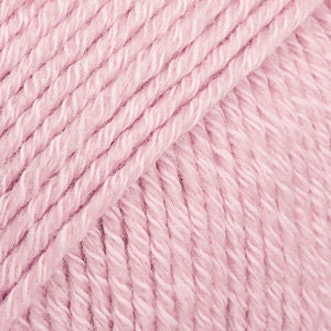 May include: A skein of pale pink yarn, a soft and fluffy texture.