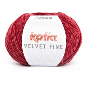 May include: A ball of Katia Velvet Fine yarn in a deep red color. The label reads "±50 grs.-1 oz 3/4 ±160 mts.-174 yds. Katia VELVET FINE".