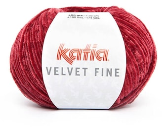 May include: A ball of Katia Velvet Fine yarn in a deep red color. The label reads "±50 grs.-1 oz 3/4 ±160 mts.-174 yds. Katia VELVET FINE".