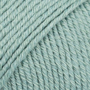May include: A skein of light blue yarn.