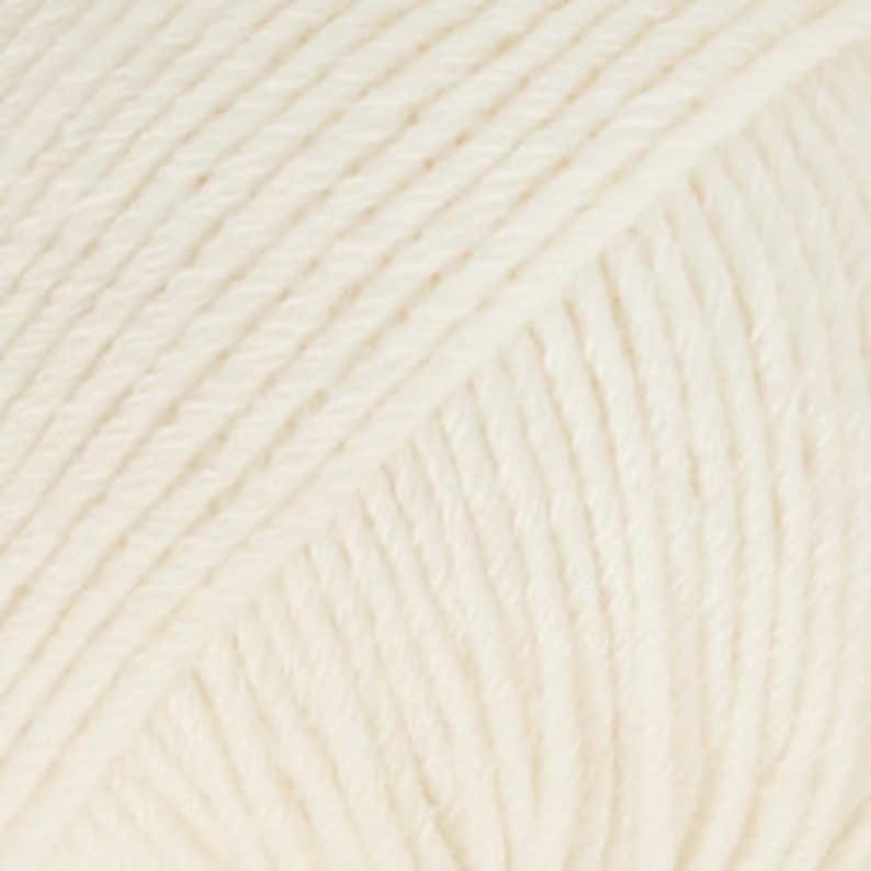 May include: A skein of off-white yarn.