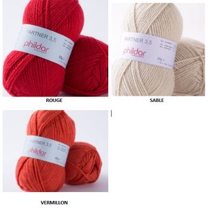Peut inclure: Deux pelotes de laine rouge &eacute;tiquet&eacute;es "Partner 3.5 phildar" et deux pelotes de laine orange &eacute;tiquet&eacute;es "Partner 3.5 phildar".