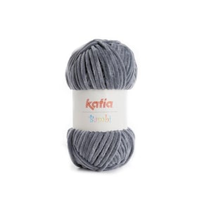 May include: A ball of gray Katia Bambi yarn. The yarn is a soft, plush material, ideal for knitting or crocheting projects. The label features the Katia logo and the name "Bambi" in a playful font.