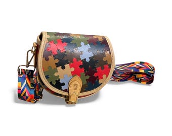 United Colours of Bulldog Compact Jigsaw Leather Horseshoe / Tambourine bag, with Alcantara style lining.