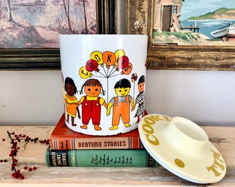 Vintage Ransburg Cookie tin; It's a Small World graphics