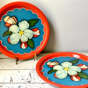 Vintage metal serving trays with magnolia blossoms