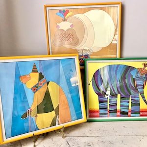 Vintage circus-themed Herrero prints; framed under glass