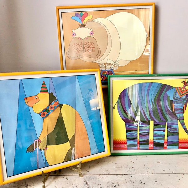 Vintage circus-themed Herrero prints; framed under glass