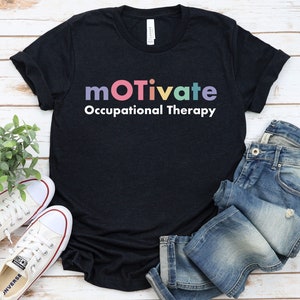 May include: A black t-shirt with the text "motivate Occupational Therapy" in rainbow colours.