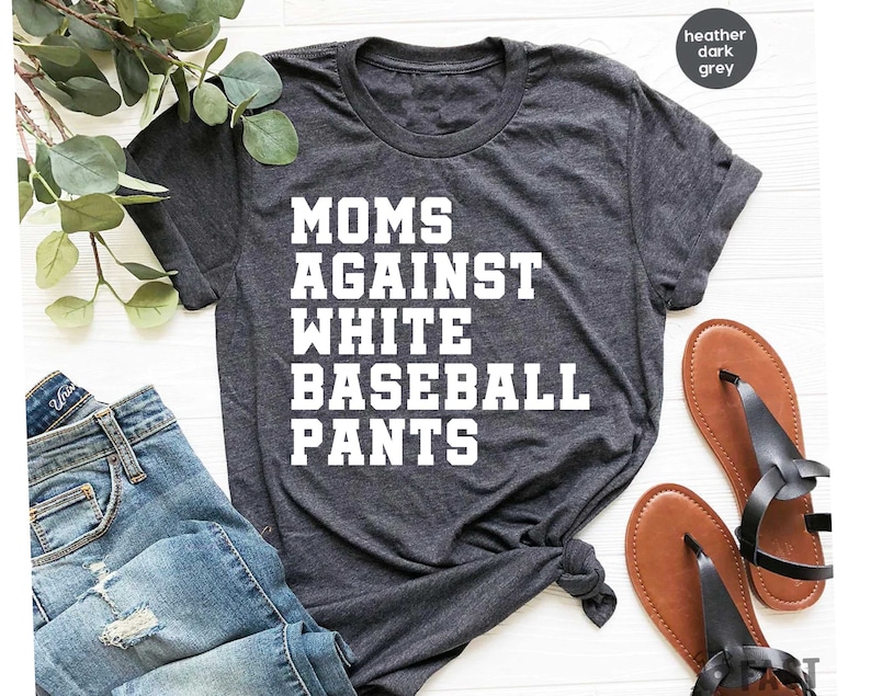 May include: Heather dark grey t-shirt with the text "MOMS AGAINST WHITE BASEBALL PANTS" printed in white.
