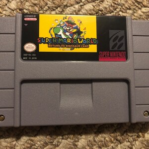 Super Mario World Return to Dinosaur Land Super Nintendo SNES Video Game