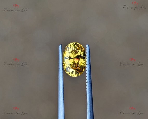 A natural, elegant heat treated Earth-mined Ceylon golden yellow sapphire cut into a oval shape.  This stone weighs 1.06 Carat.