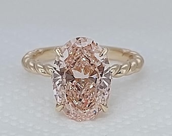 3 Carat Lab Grown Pink Diamond Engagement Ring: 18k Yellow Gold Oval Cut engagement ring in flower prong.