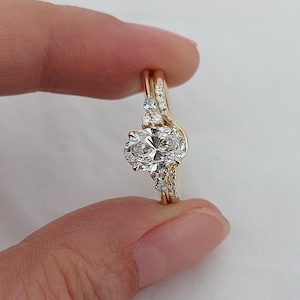 1.5 Carat Oval Cut Lab Grown Diamond Solitaire Engagement Ring & Matching Round Diamond Wedding Band, IGI Certified D/VVS2, 14K Yellow Gold.