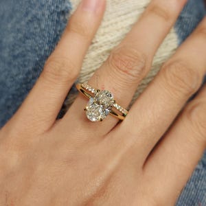 2.2 Carat Oval Cut Lab Grown Diamond Solitaire Engagement Ring & Matching Round Diamond Wedding Band, IGI Certified D/VVS2, 14K Yellow Gold.