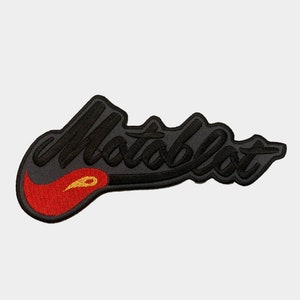 May include: Black and red embroidered patch with the word "Motoblott" in a stylized font. The word is outlined in black and has a red flame design at the beginning.