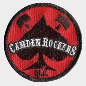 May include: A red and black embroidered patch with a spade design and the text "Camden Rockers M.C."