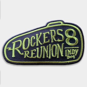 May include: A black and green embroidered patch with the text "Rockers 8 Reunion Indy 2014".