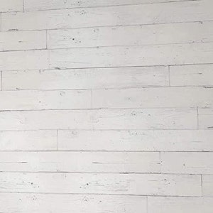 May include: Whitewashed wood paneling with a rustic, distressed look. The wood planks are arranged horizontally, creating a clean and modern aesthetic.