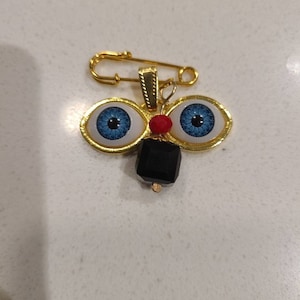 Amuleto Ojo De Santa Lucia Pin Mal De Ojo com Azabache Santeria Boa Sorte
