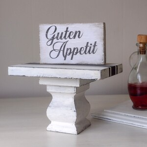 Guten Appetit German sign on wood riser. White & black. Glass vintage vinegar & oil holders