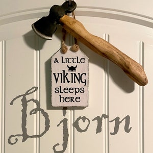 Viking themed Nursery with Scandinavian Sign. A little viking sleeps here. Viking Axe. Bjorn babies name painted on wall