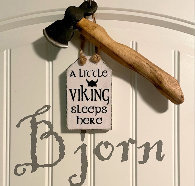 Viking themed Nursery with Scandinavian Sign. A little viking sleeps here. Viking Axe. Bjorn babies name painted on wall