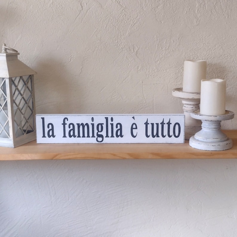 Italian Family is Everything sign. La Famiglia e tutto. White & Black. White candlestick holders, white lantern